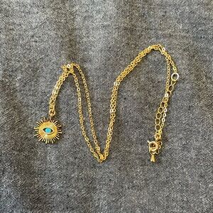Gold Filled seeing eye with turquoise stone.